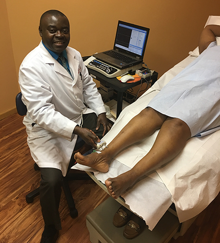 Dr. Ankamah performing an EMG (Nerve Test) Procedure